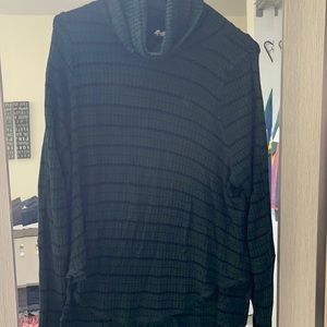 Green and black striped sweater